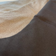 Close up of three legging fabrics- jet black, heather grey, heather sky blue